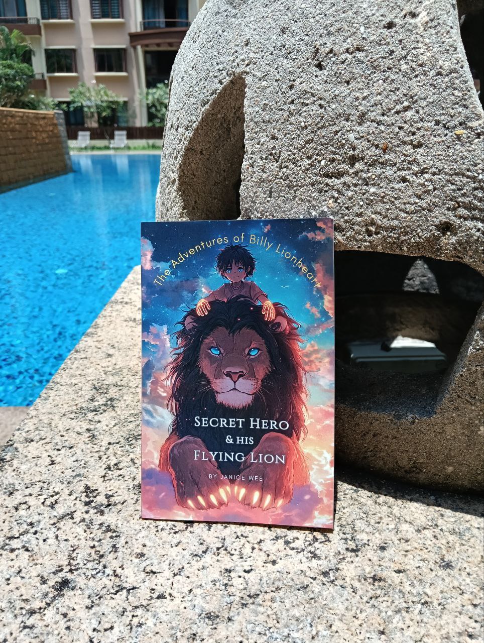 Secret Hero & His Flying Lion by Janice Wee. A high school cosy mystery with superpowers and talking animals.